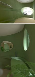 Nature Enters This Pastel Green Café in China Through Irregular Curves