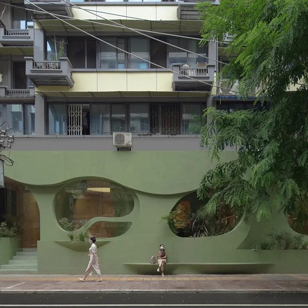 Nature Enters This Beautiful Pastel Green Café in China Through Irregular Curves