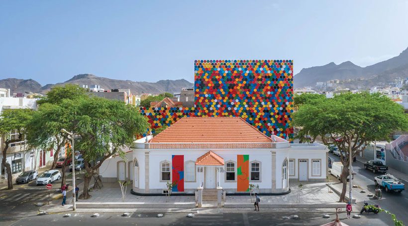 Vibrant Mosaic Façade Made of Recycled Barred Lids
