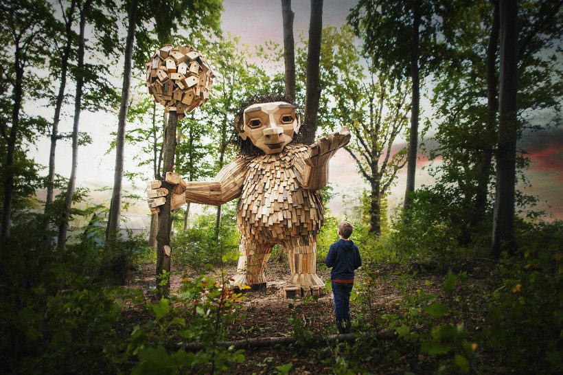 a wooden troll sculpture