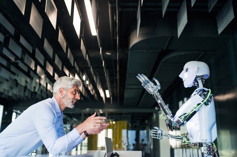 a man talking to robot