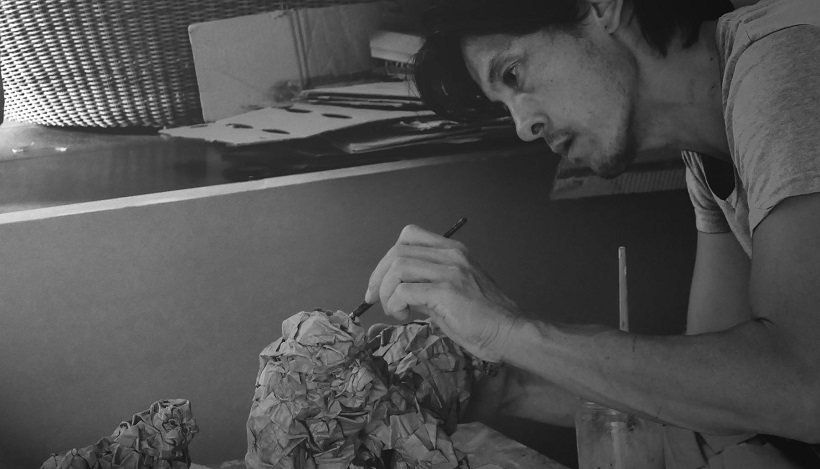 Olivier Bertrand working on his cardboard sculpture