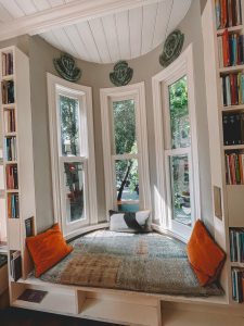 a reading nook in front of a window