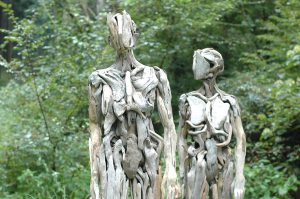 two sculptures in the forest