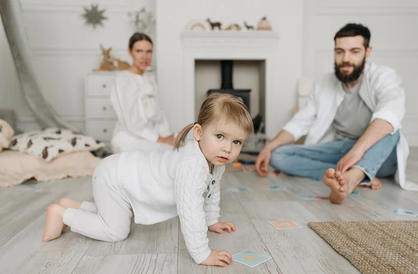 a child playing with her parents