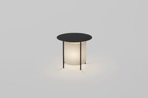 a coffee table with a lamp