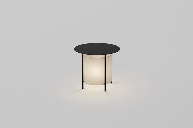 a coffee table with a lamp