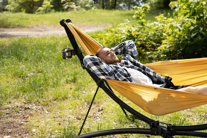a man sleeping on a hammock