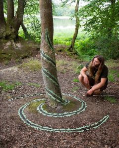 Foreman performs his art on a tree