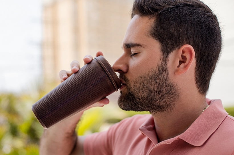 a man dringking coffee