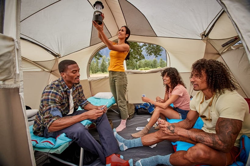 a large group of friends camping
