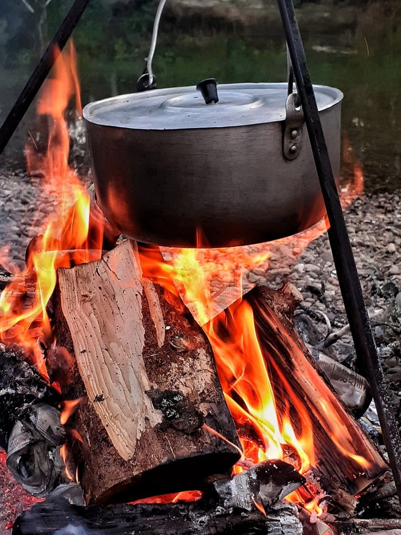 a pot on a campfire