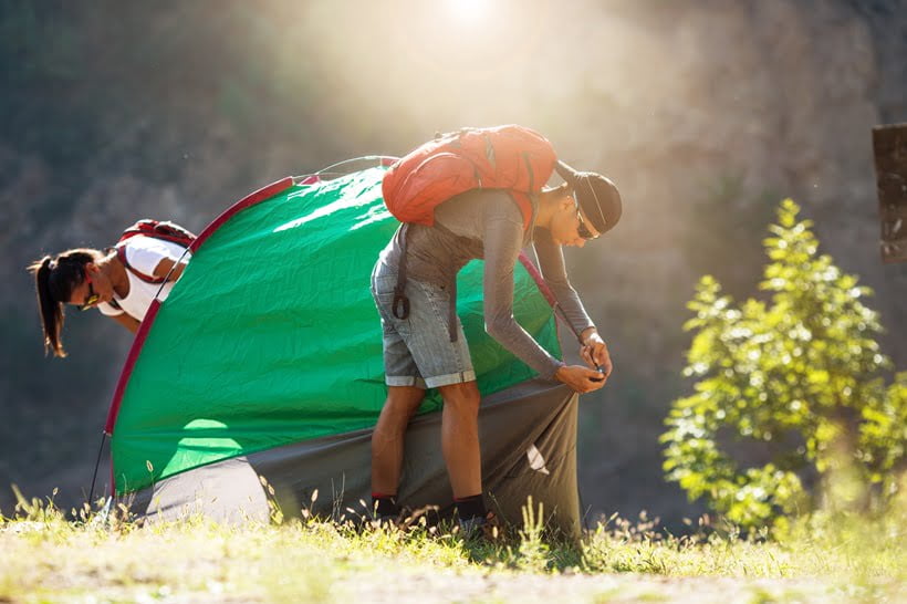setting up camping tent