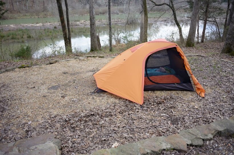 a camp tent near lake