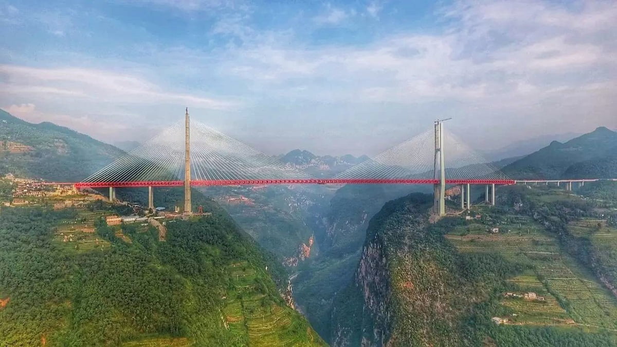 The Beipanjiang Bridge stands as a breathtaking marvel of modern engineering and design high above the dramatic landscapes of China.