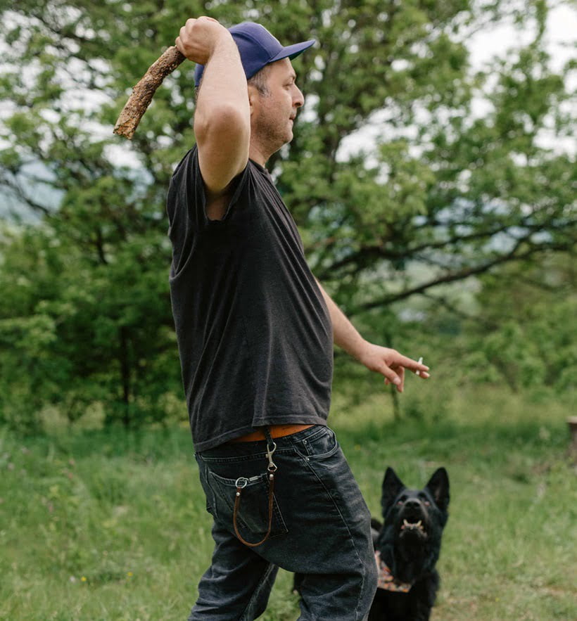a man playing with his pet