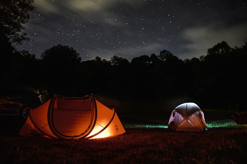 two dome tents at night