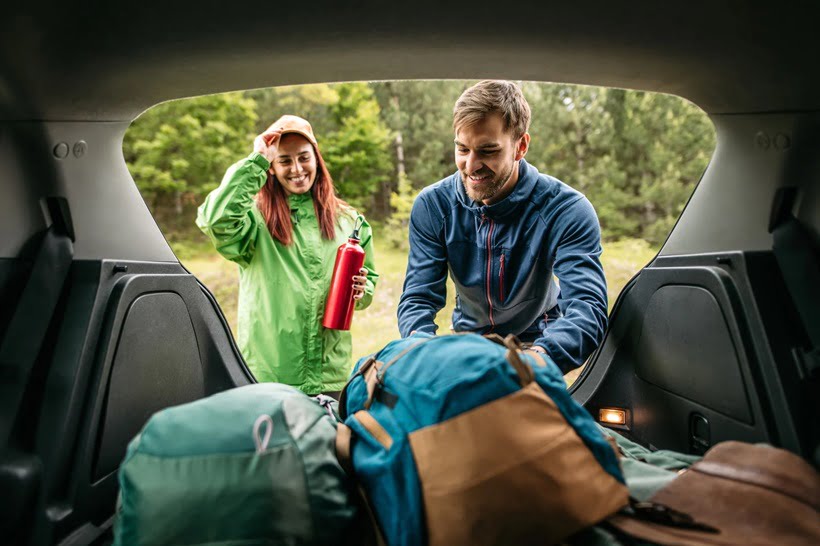 couple arranging camping gear
