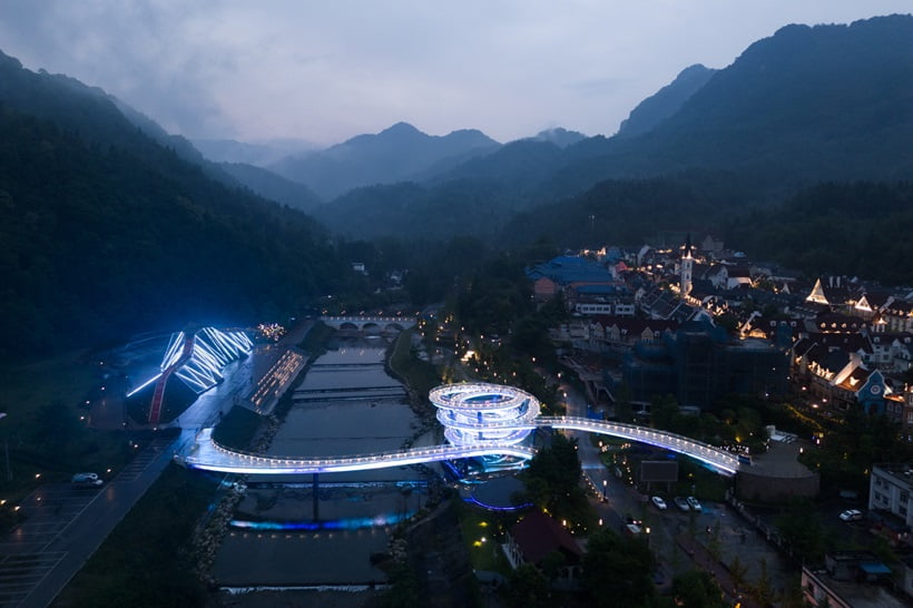 a road on a lake with lights