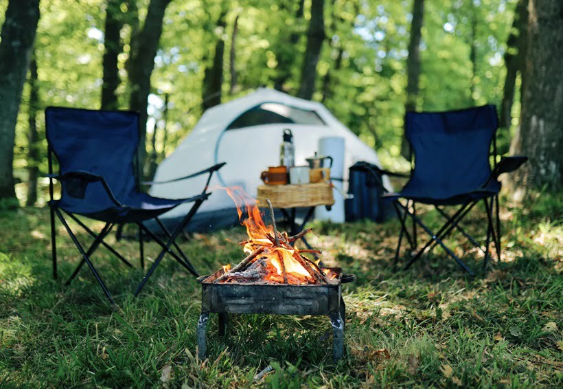 chairs in front of a camping tent