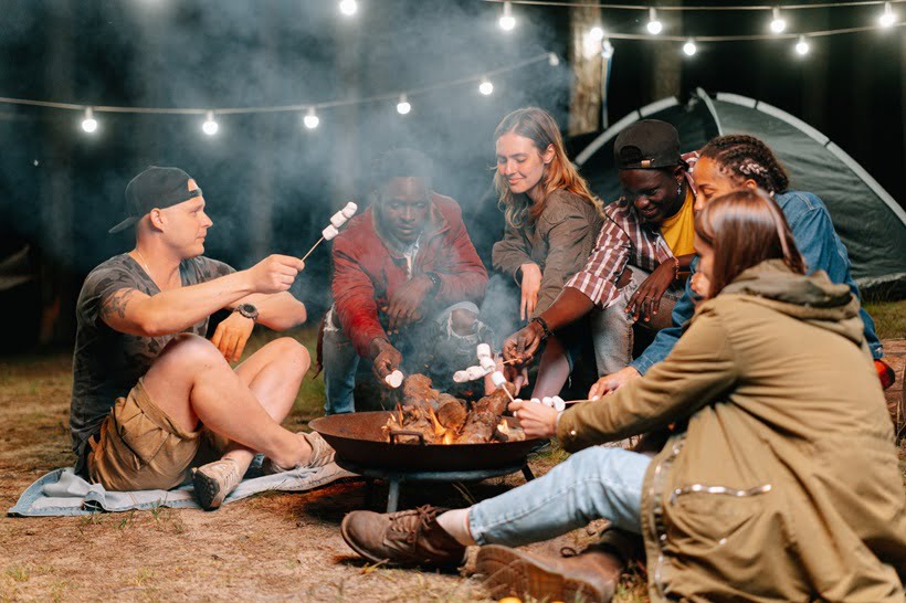 a group of friends eating fried marshmallows