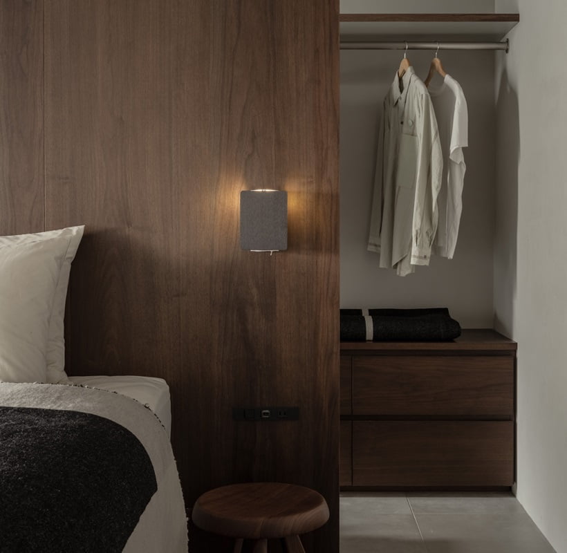 wardrobe behind the bed