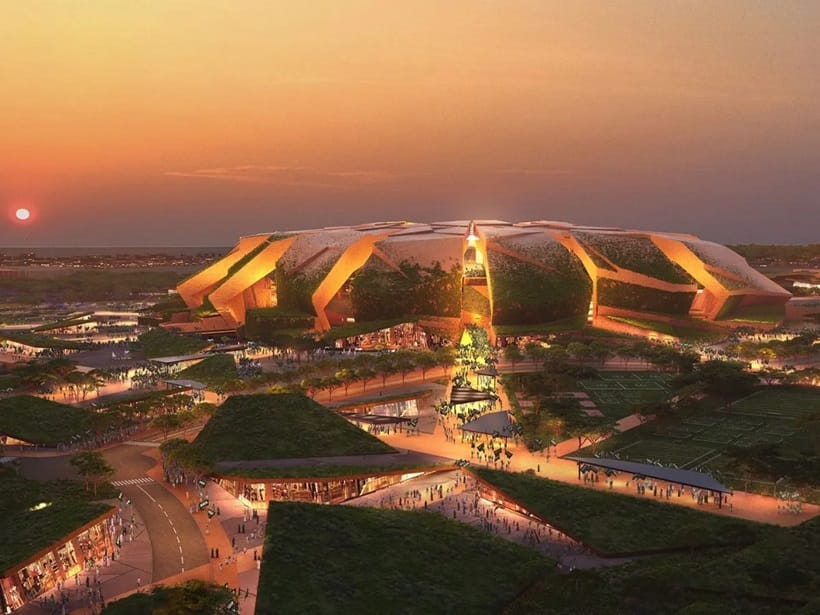 the sun sets above the city