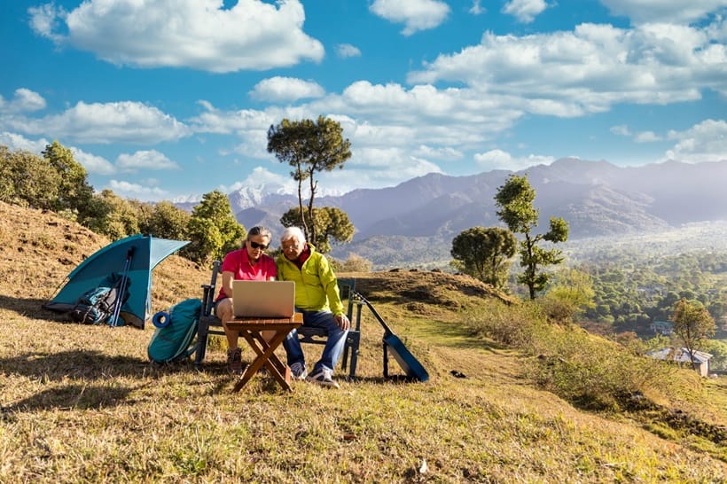 senior couple looking at laptop