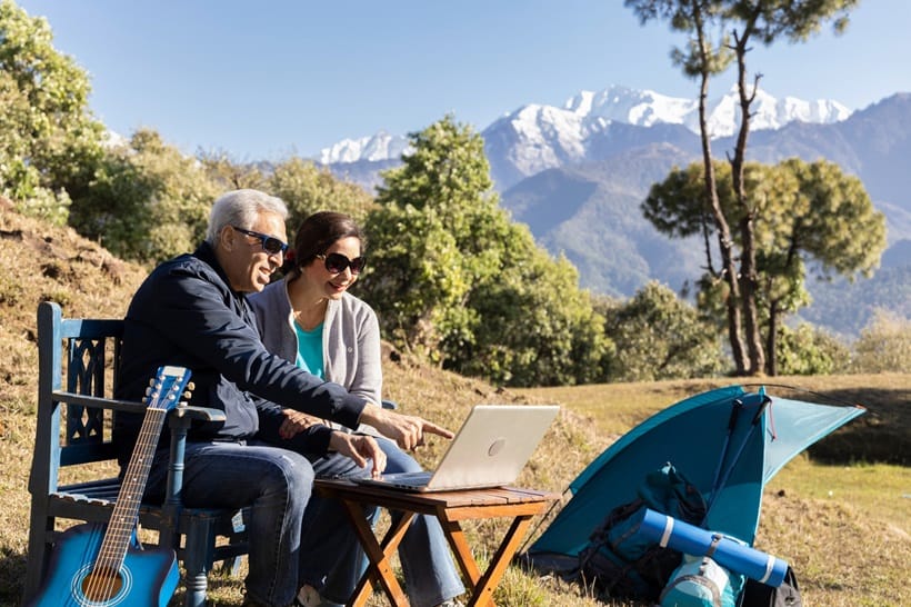 old couple watcing video on their laptop