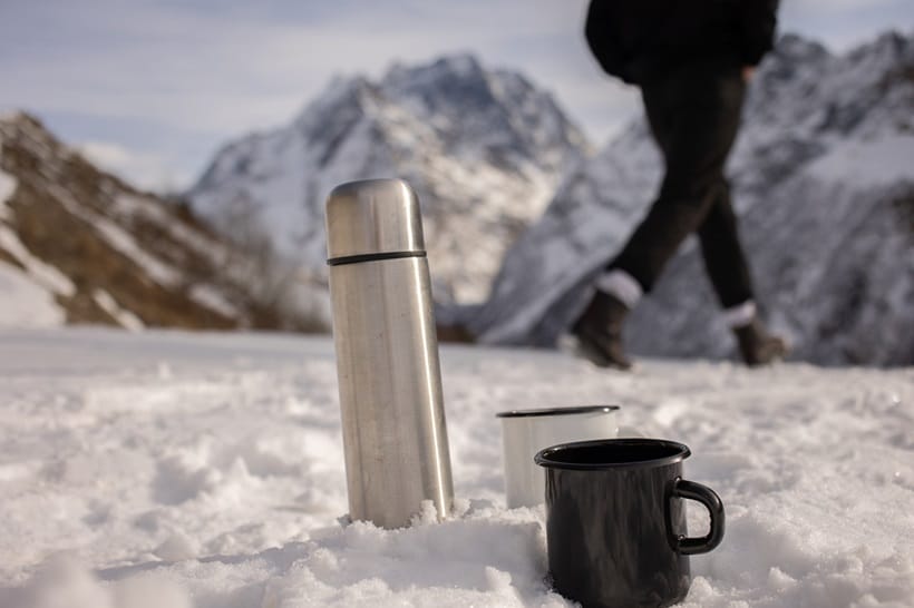 stainless steel water bottle on snow