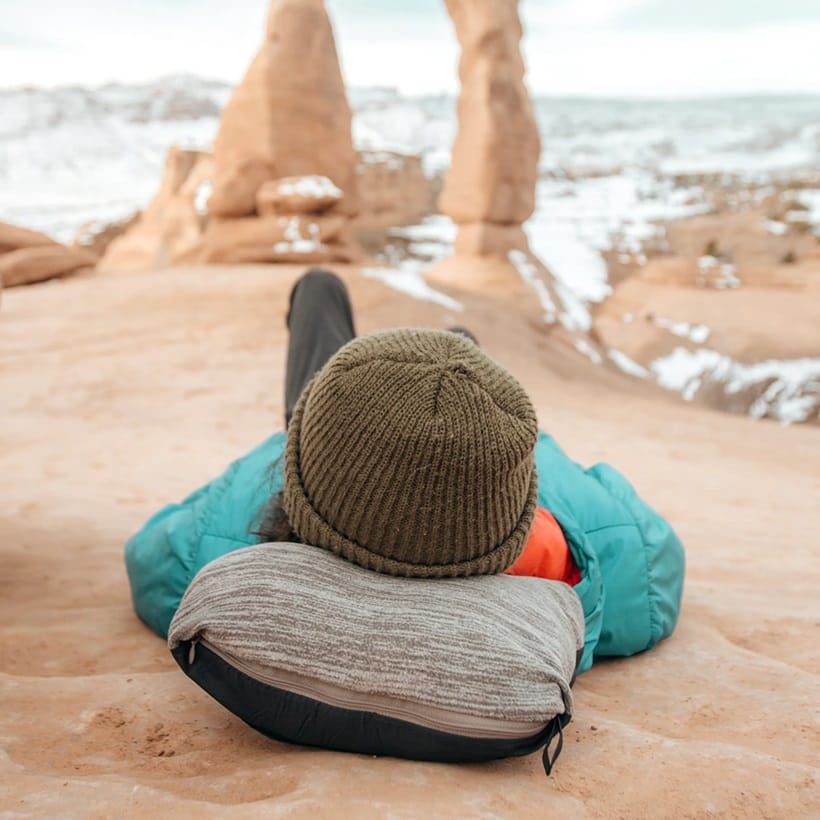 a man lying on the beach