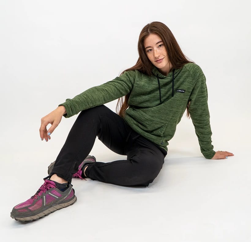 a woman in a green hoodie