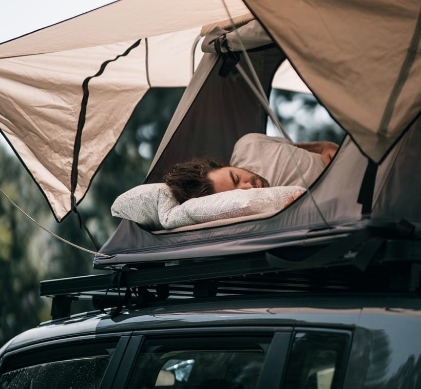 a man sleeping on his mattress