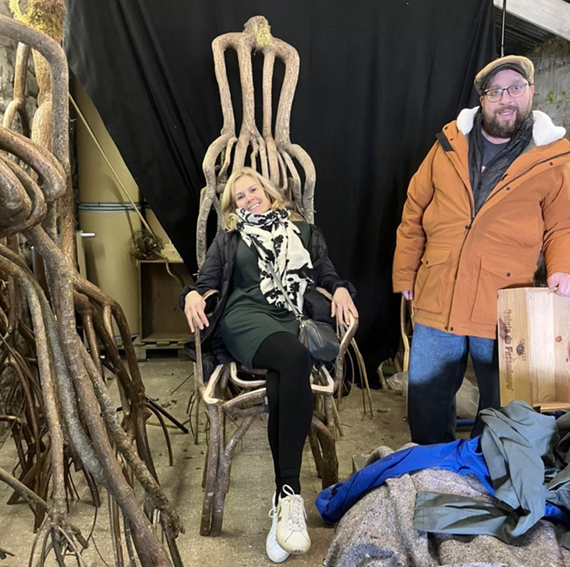 a woman stting on living furniture