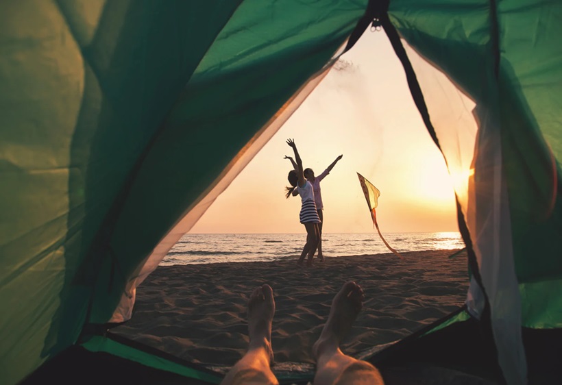 two women enjoyng beach camping