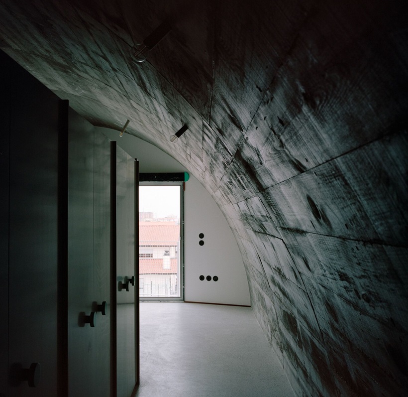 Fala Atelier inverted roof house has both a sloped and curved roofline that creates a unique and instantly recognizable silhouette.