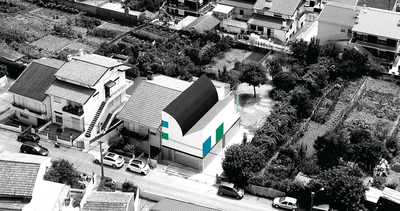 a focused view of the sloped house in Portugal