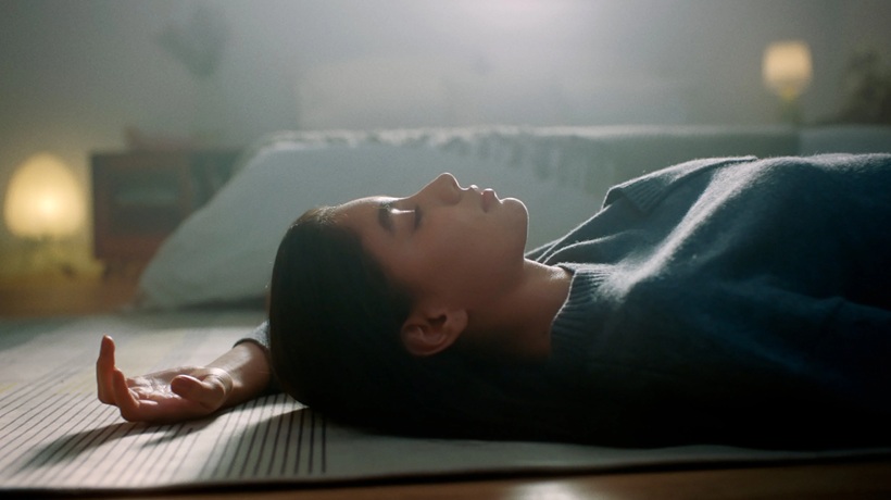 a woman meditating on the floor